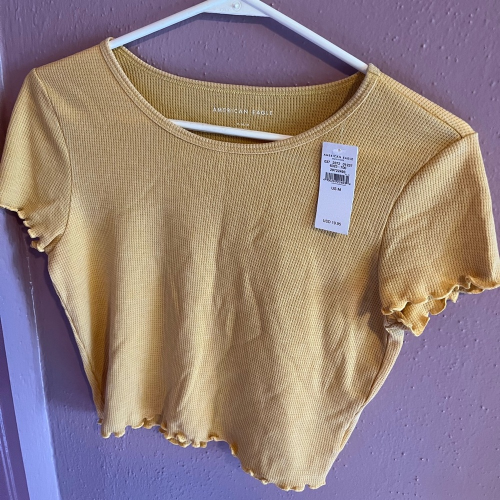 Scalloped T